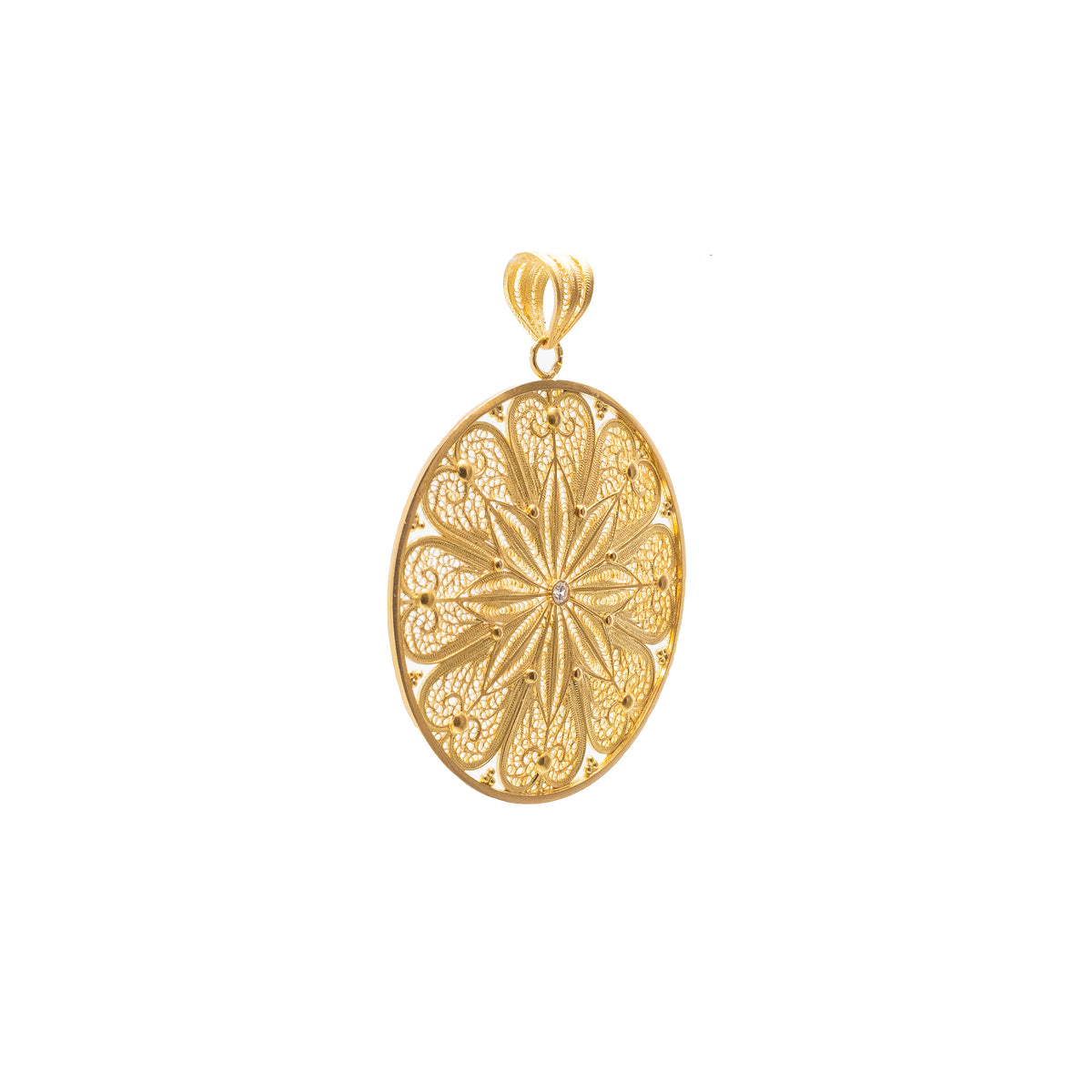 Gold medal with filigree and diamond.