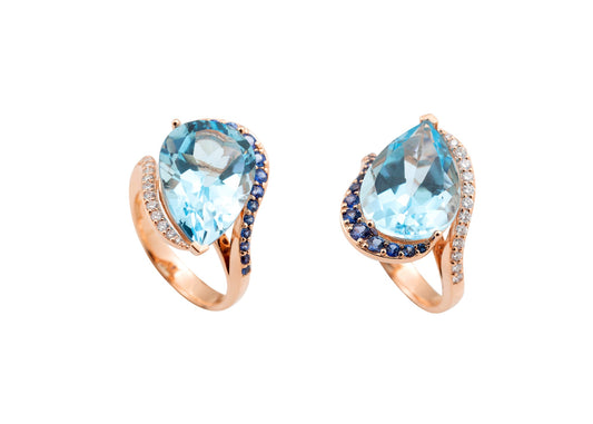 Anel em ouro, com gota de topázio azul, safira azul e diamantes