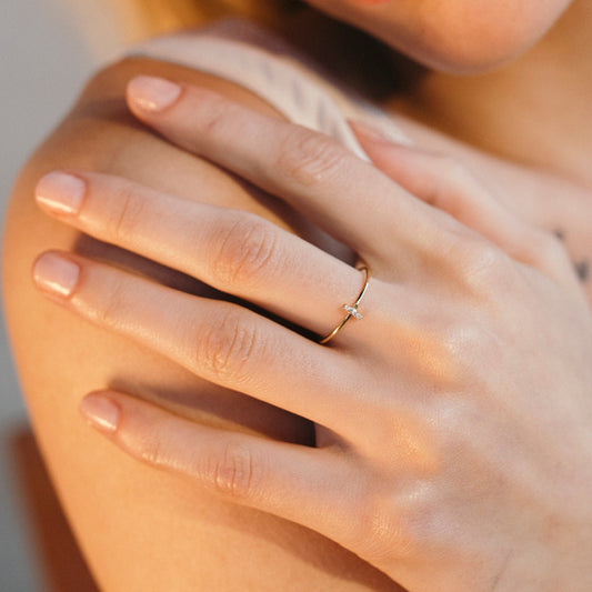 Gold ring with diamond setting.
