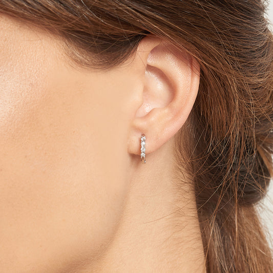 White gold hoop earrings with 4 diamonds.
