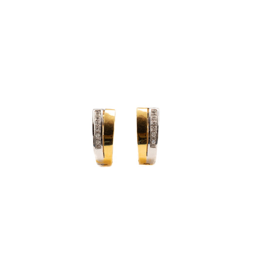 Two-tone gold hoop earrings with diamonds.